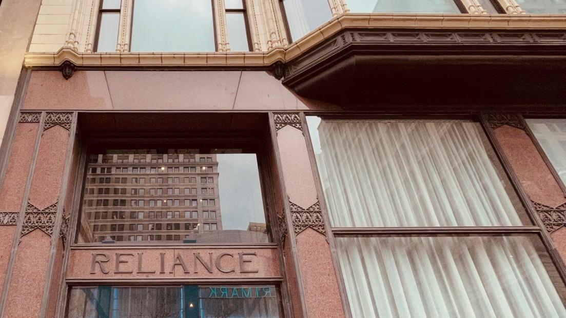 A photo of Reliance Building (exterior close & interior)