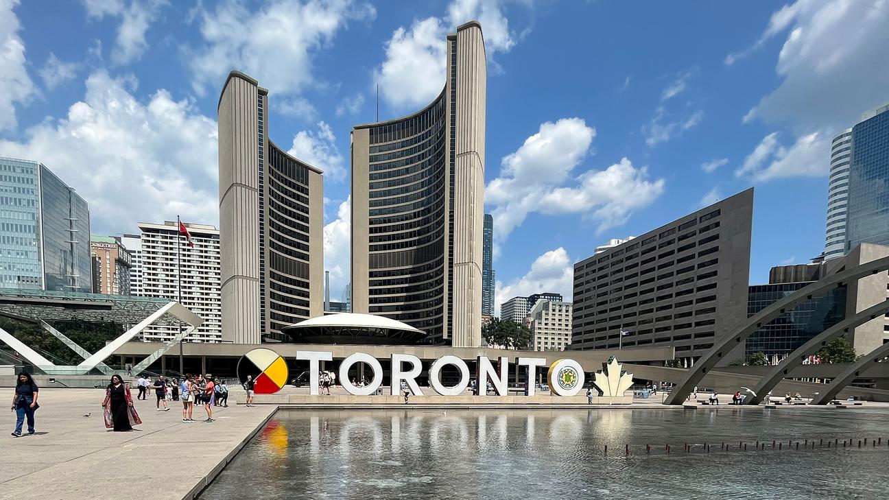 A photo of Nathan Philips Square (The TORONTO SIGN) & New City Hall